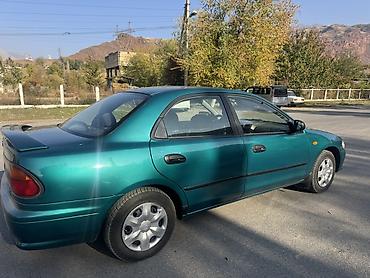 плуг для мтз трактора: Mazda 323: 1997 г., Механика, Бензин, Седан — 7