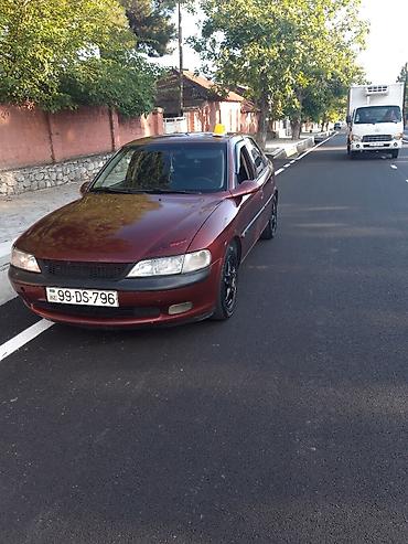 opel ehtiyat hisələri: Opel Vectra sedan – vişnə rəngi, 4 qapı, qara disklər, tonlu şüşələr — 2