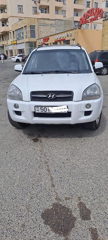 suzuki grand vitara: Hyundai Tucson: 2 l | 2006 il Ofrouder/SUV — 1