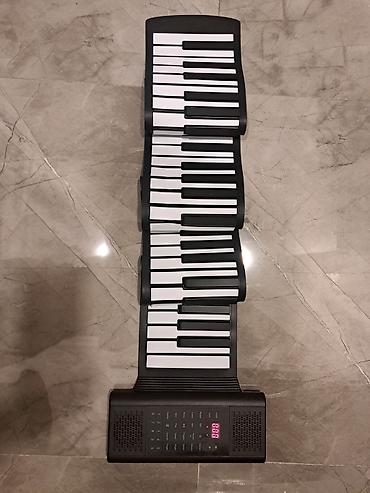 Musiqi alətləri: Daşınan qatlanan rəqəmsal piano (roll-up keyboard) Maya deyerine — 1