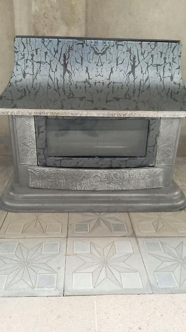 İran sobası – dekorativ camlı ön panel və relyef naxışlı metal gövdə lalafo.az -da İran sobası – dekorativ camlı ön panel və relyef naxışlı metal gövdə