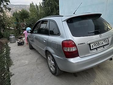 мото зонтик: Mazda Familia: 1999 г., 1.5 л, Автомат, Бензин, Универсал — 1