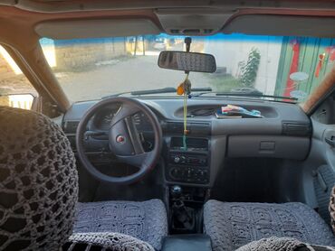 Opel: Model: Opel Astra F Caravan (universal kuzov) Rəng: qara Dövlət nömrə — 14