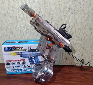 inkişaf etdirici oyuncaqlar: ● Bu, "Uzi Ice Horn" modeli olan elektrikli su tapançasıdır ● Tapança — 5