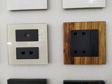 razetqa: Divar üçün nəzərdə tutulmuş müxtəlif dizaynlarda elektrik rozetkaları