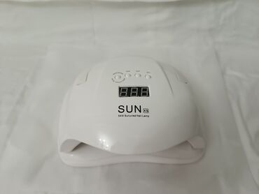 Dırnaq qurutma lampaları: SUN 5S brendinə məxsus, dırnaqlar üçün UV LED lampası. Ağ rəngdədir və — 5
