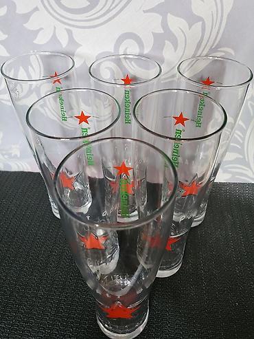 Čaše: Case nove za pivo Heineken. Case nove,sve na njima odsjaj od svetla — 8