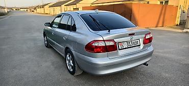 чехол на мопед: Mazda 626: 2000 г., 2 л, Механика, Бензин, Хэтчбэк — 5