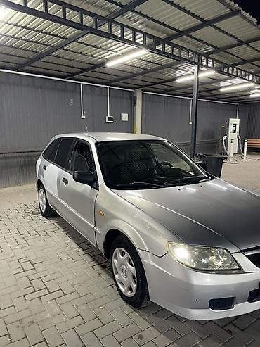 мини электро: Mazda 323: 2003 г., 1.3 л, Механика, Бензин, Хэтчбэк — 2