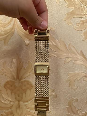 DKNY qadın qol saatları (2 ədəd set) 1) Qızılı rəngli DKNY saat -