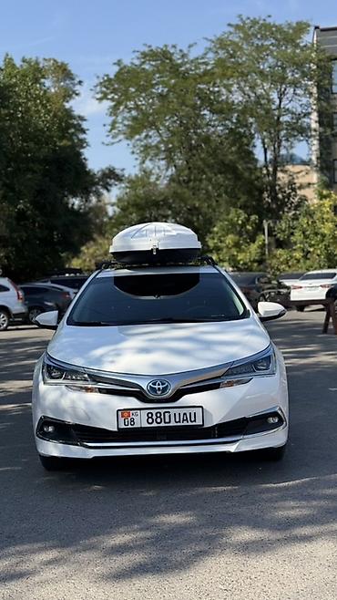 Toyota Corolla: 2019 г., 1.8 л, Робот, Гибрид, Седан