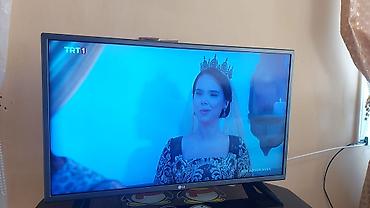 ТВ и видео: LG televizor + şüşə TV stendi - 82 Ekran - Pultu var Televizor — 1