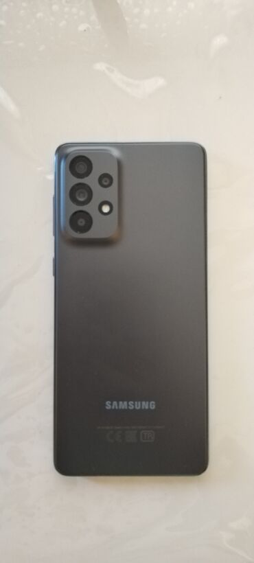 en ucuz samsung telefon: Samsung Galaxy A73 5G, 128 ГБ, цвет - Серый, Кнопочный, Сенсорный, Отпечаток пальца