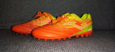 Кроссовки и спортивная обувь: Продаю бусты Joma 36размер (оригинальныешипы) оранжевого цвета