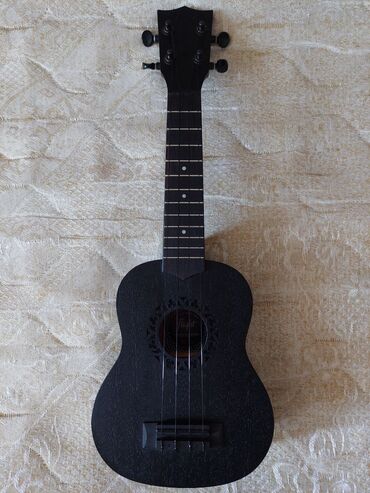 gitara qara: Ukulele, İşlənmiş, Ünvandan götürmə