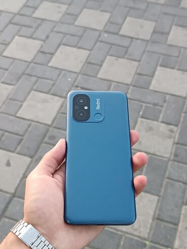 телефон флай 4404: Xiaomi Redmi 12C, 128 ГБ, цвет - Синий, 
 Кнопочный, Отпечаток пальца
