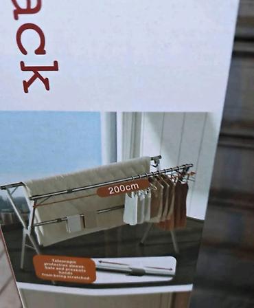 trpezarijake stolice: Stalak za sušenje veša sa teleskopskim šipkama. Stalak je dugačak 200 — 7