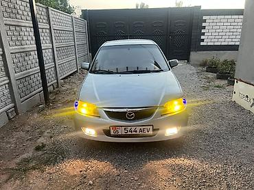byd bot 384: Mazda 323: 2001 г., 1.6 л, Механика, Бензин, Универсал — 1