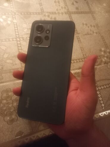 islenmis telefonlar qiymetleri: Xiaomi Redmi Note 12, 128 ГБ, цвет - Синий, 
 Отпечаток пальца