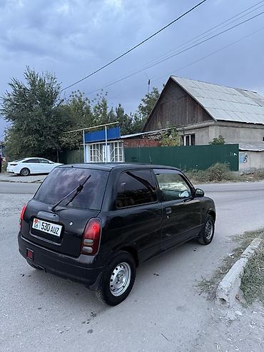 муравей с бензином: Daihatsu Cuore: 2001 г., 1 л, Механика, Бензин, Купе — 3