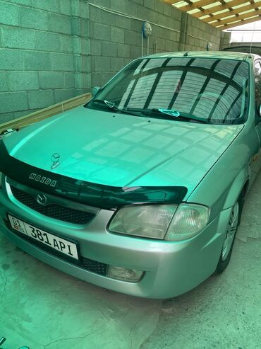 автомобили мазда: Mazda 323: 2000 г., 1.6 л, Автомат, Бензин, Седан