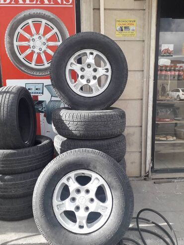 pajer: 4 təkər pajero disklə bərabər 
Yaponiya dı 265 70 16 olcu