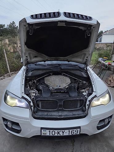 aksesuar avto: BMW X6 (E71), ağ rəng, Azərbaycan qeydiyyat nömrə nişanı ilə. Texniki — 3