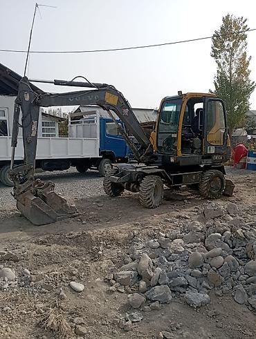 хово v5x: Экскаватор, Volvo, 2005 г., Колесный — 2