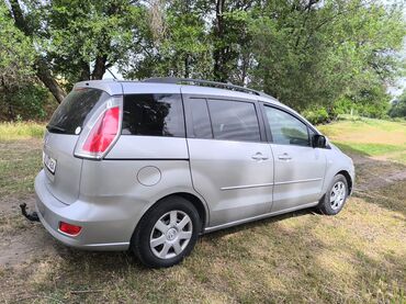 мазда е 2200: Автомобиль Mazda 5 серебристого цвета. Семейный минивэн с просторным