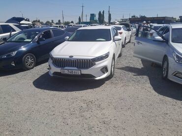 киридит машина: Белый седан Kia K5, который сочетает в себе элегантный дизайн и
