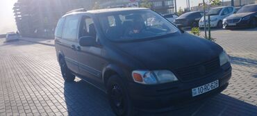 Tünd göy rəngli Opel Sintra minivani, geniş ailələr və ya yükdaşıma