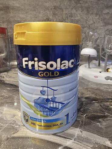 Qida məhsulları: Frisolac Gold 1 körpə yemi tozu. Üzərindən 4 qaşıq istifadə olunub — 1