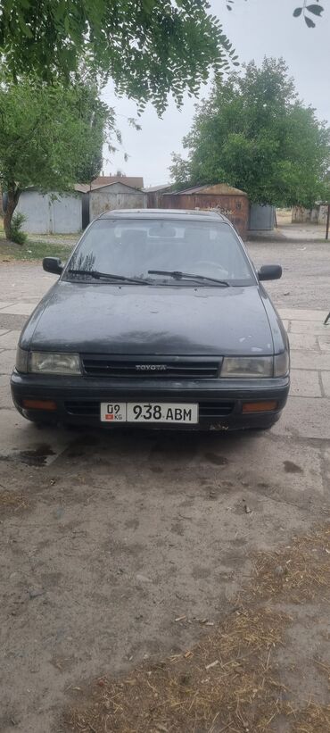 домкрат на тойота: Toyota Corolla (E2), седан темно‑серый цвет.об 1.6.1989года прошу