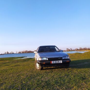 машина 50000сом: Mazda 323: 1988 г., 1.4 л, Механика, Бензин, Хэтчбэк