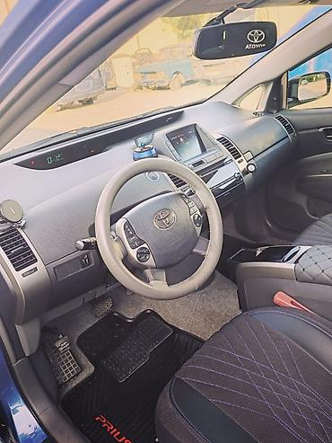 masini hibrid ieftine: Toyota Prius (2-ci nəsil, liftback), mavi rəng. - Hibrid güc qurğusu — 9