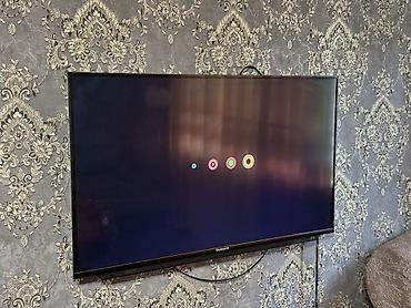 skyworth машина: Телевизор Skyworth, диагональ примерно 43–50" (узкие рамки, настенное — 1