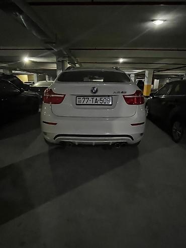 x6 bmw: BMW X6, ağ rəng, 4 qapılı kupe-SUV gövdə. Güclü və dinamik görünüşlü — 4
