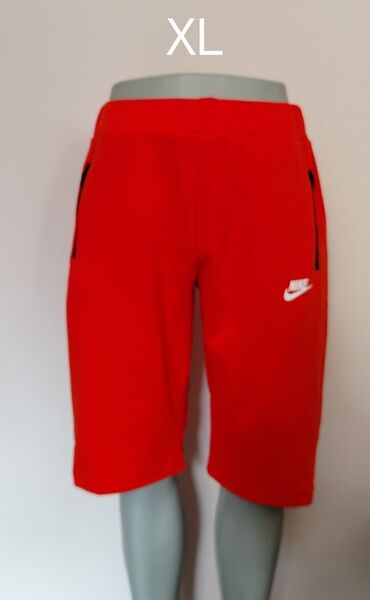 kutije za nakit – слике: Narandžasti šorts brenda Nike, veličine XL. Ima elastični pojas i logo
