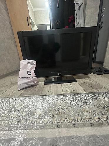 lg 24: Телевизор LG, диагональ около 26–32". Плоская ЖК/LED‑панель — 3