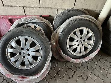 титан моноблок: Комплект из 4 легкосплавных дисков Honda с зимними шинами. - — 1