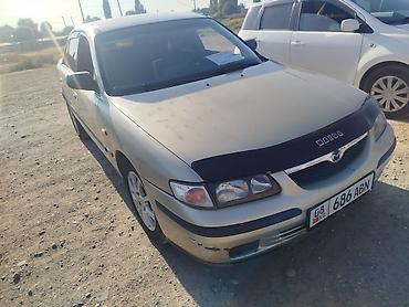 бу тачила: Mazda Capella: 1998 г., 1.8 л, Механика, Бензин, Седан — 1