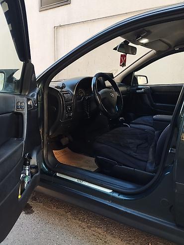 bmw e 38: Opel Astra: 1.6 l | 1999 il 400 km Sedan — 4