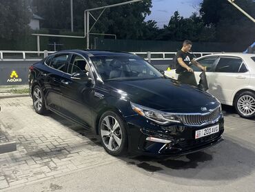 кия сол: Круглосуточное езды на иссык куль Черный седан Kia Optima с динамичным