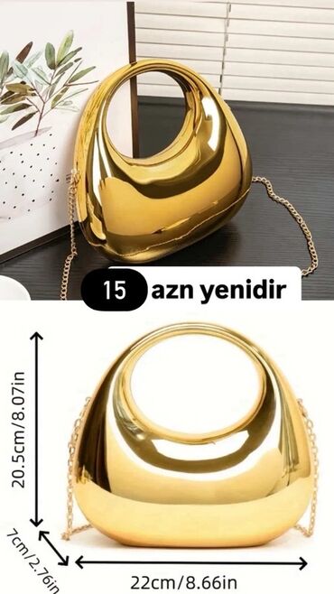 Oval formalı qızılı rəngli qadın əl çantası. Bu çanta zərif qızılı