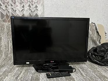 telivizor: LG LED televizor, təxminən 32 düym (diaqonal). Qara rəngli korpus — 1