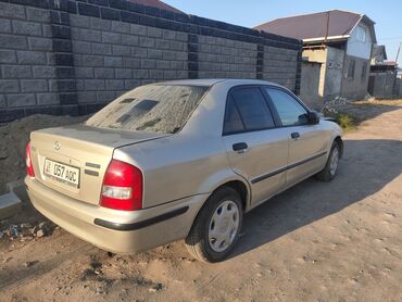 диски на венту: Mazda 323: 1999 г., 1.6 л, Автомат, Бензин, Седан
