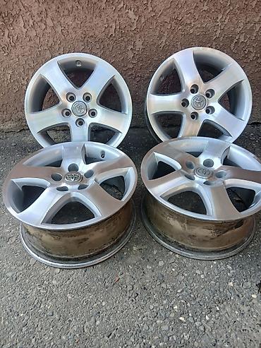 s 221: Комплект оригинальных литых дисков Toyota (4 шт.) - Диаметр: 16" - — 1