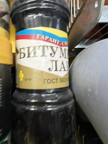алюминиевая емкость 1000 л: Битумный лак "Гарант-С" в черной бутылке с этикеткой в цветах