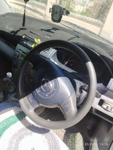 машина на колесах: Mazda Demio: 2003 г., 1.3 л, Автомат, Бензин, Хэтчбэк
