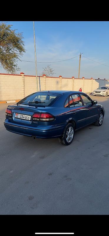 260: Mazda 626: 1997 г., 1.8 л, Механика, Бензин, Хэтчбэк — 4